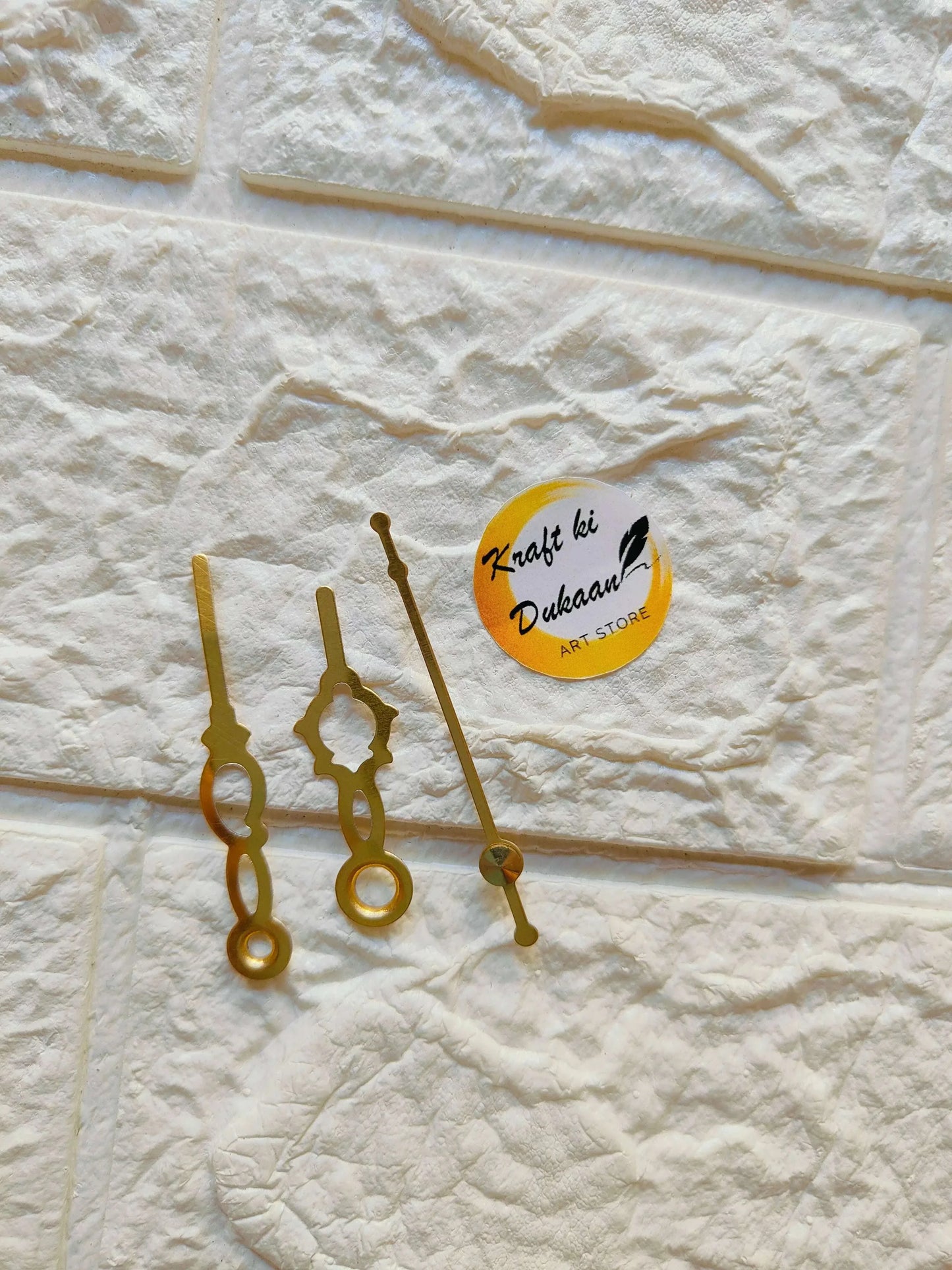 Clock hands A32 in gold metal, circular motifs and long pointer hand