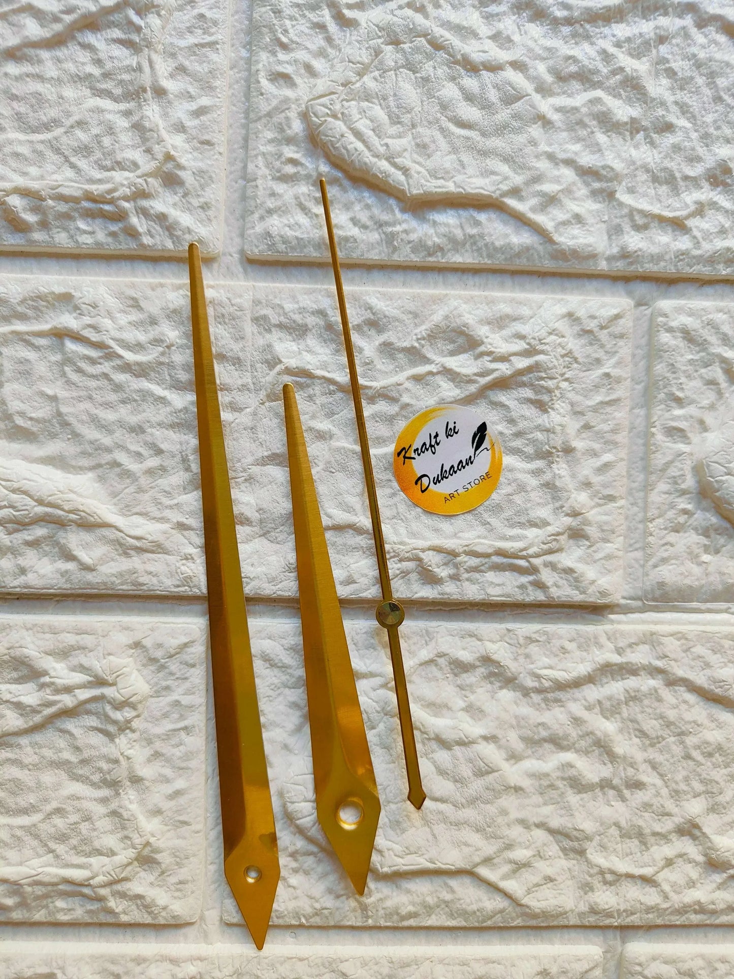Gold metal clock hands A35 with tall pointed ends and mounting holes