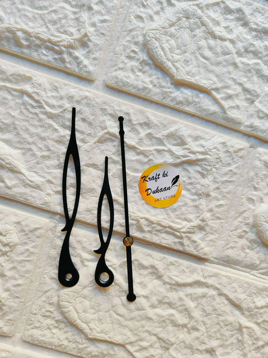 Clock hands metal set in black tones, with small brass center dot