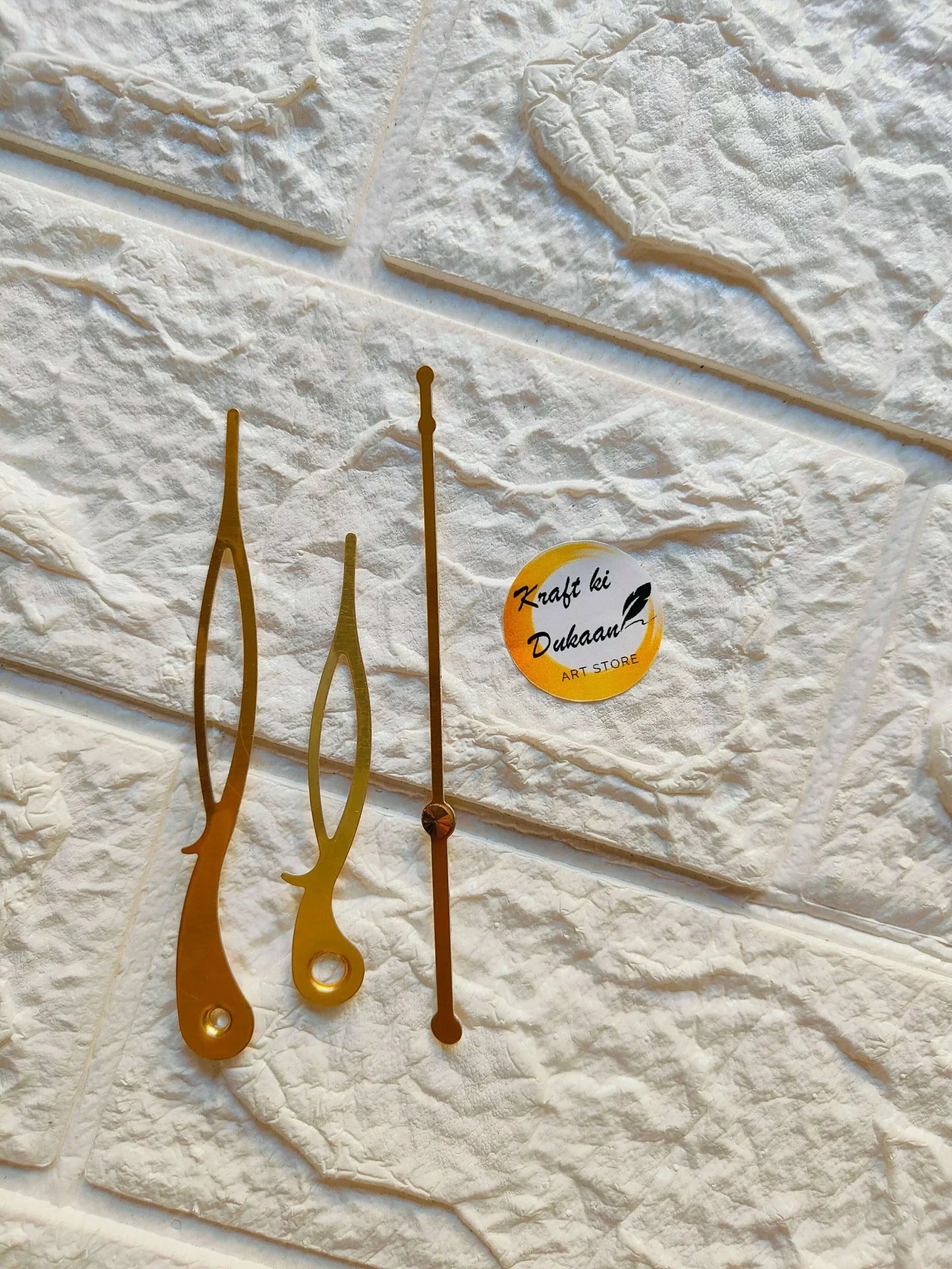 Clock hands metal set in gold tones, with brass center cap and long minute hand
