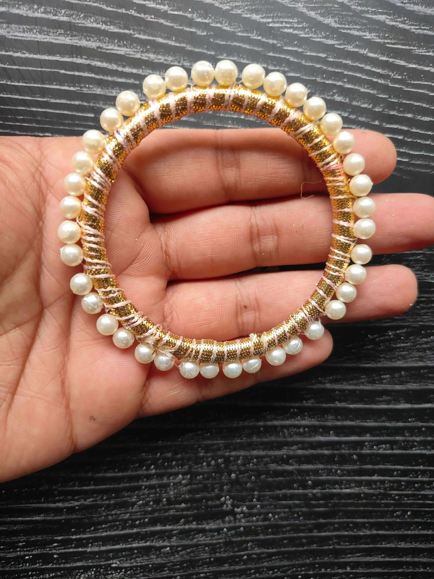 3-inch round gota ring close-up: pearl-like beads with gold embroidery trim