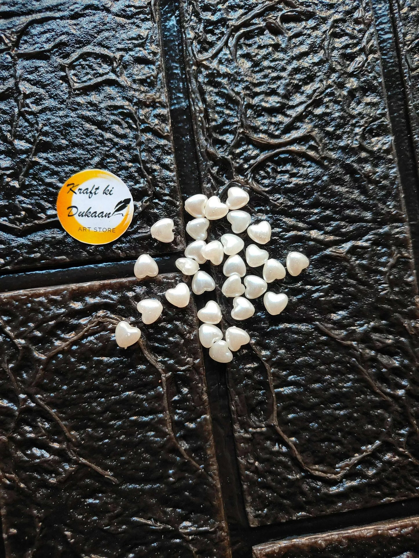 Cluster of heart-shaped white beads