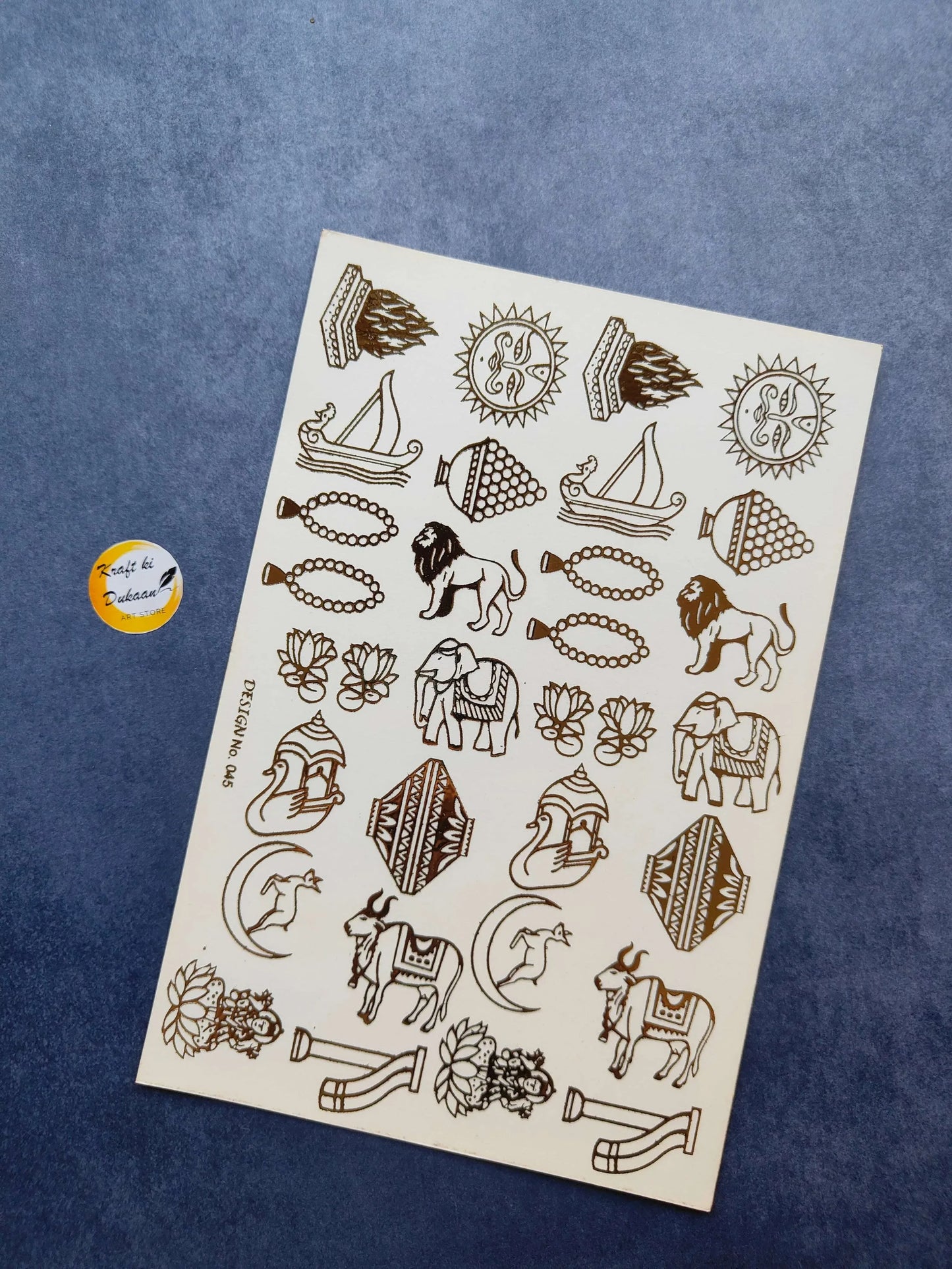 A5 gold-embossed sticker sheet with assorted line-art motifs and animals