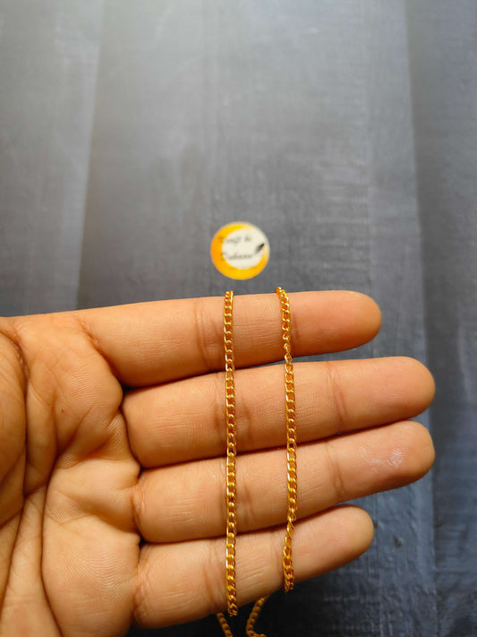 Jewellery Chain: gold curb-link chain bracelets on fingers