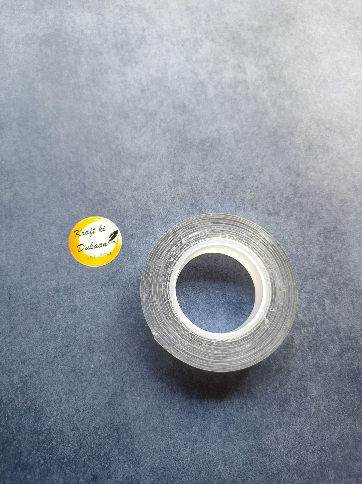 Transparent double-sided mounting tape roll, compact wound roll with clear strip