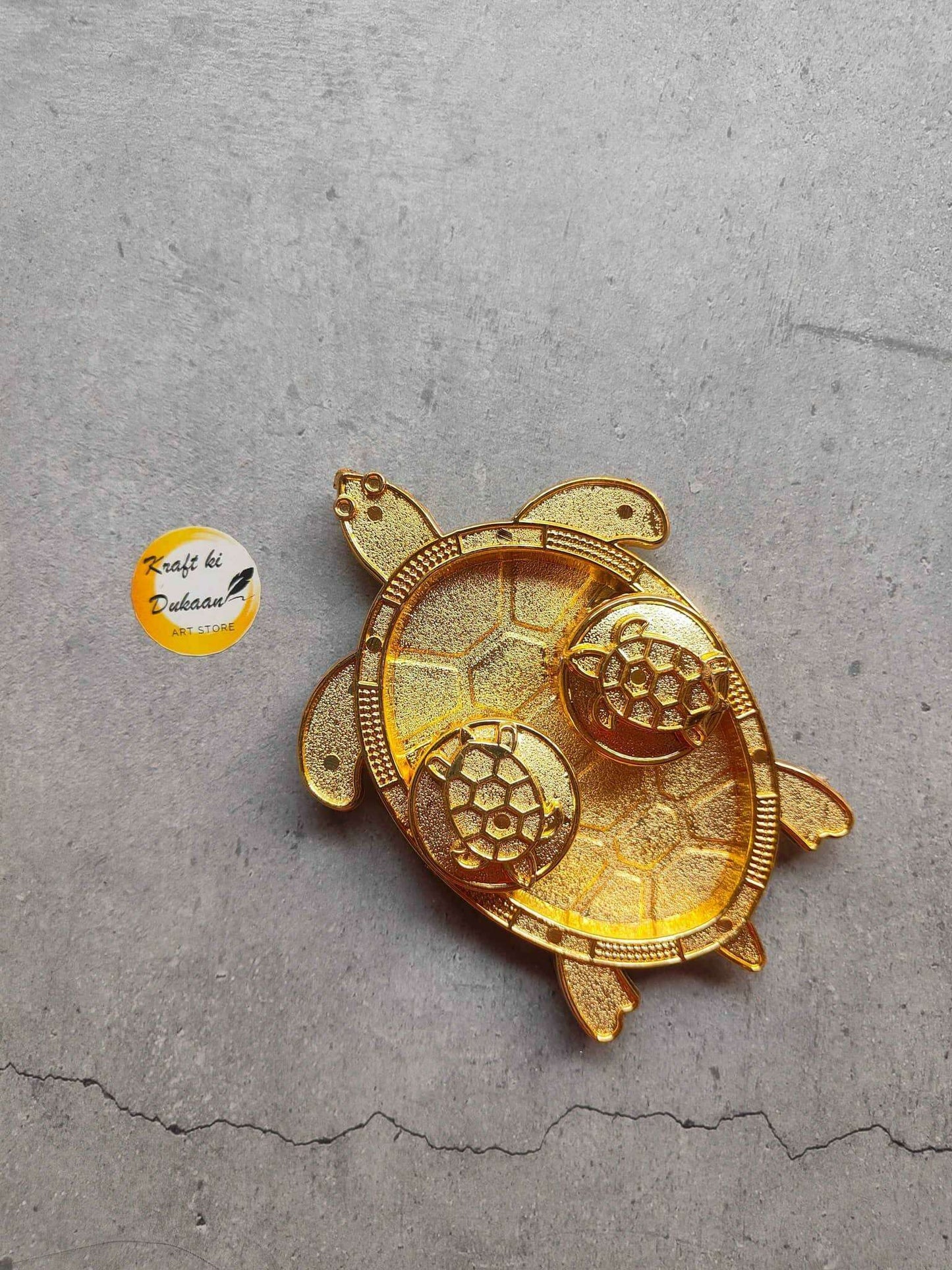 Roli Chawal Plate A11, turtle-shaped gold decorative plate with circular patterns