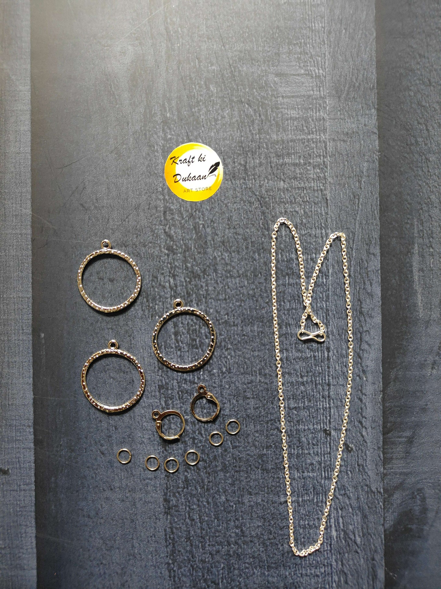 Gold necklace with round earring rings and small stud pairs