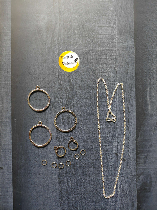 Gold necklace with round earring rings and small stud pairs