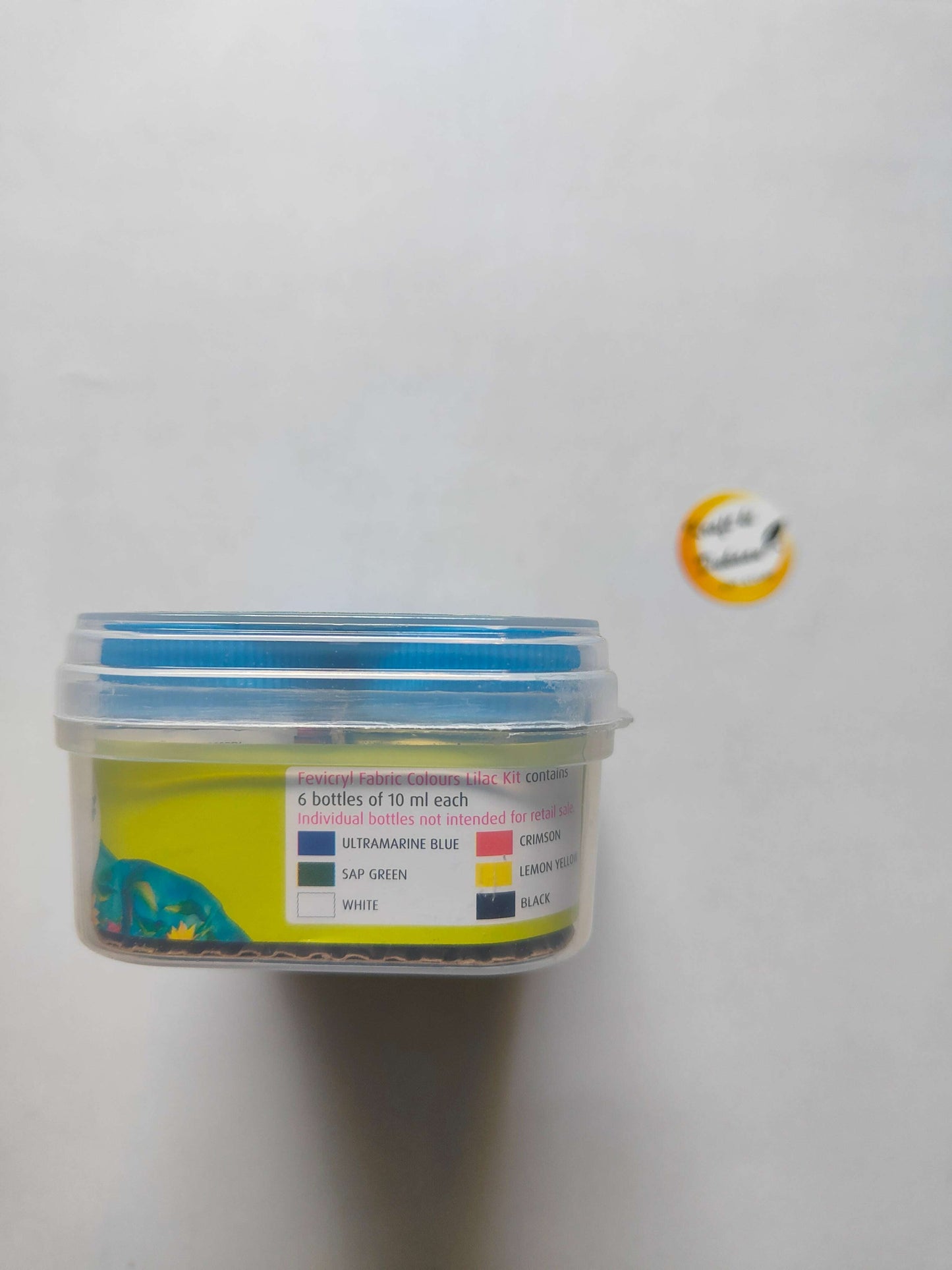 Jar label listing 6 fabric colours: white, ultramarine blue, sap green, lemon yellow, black