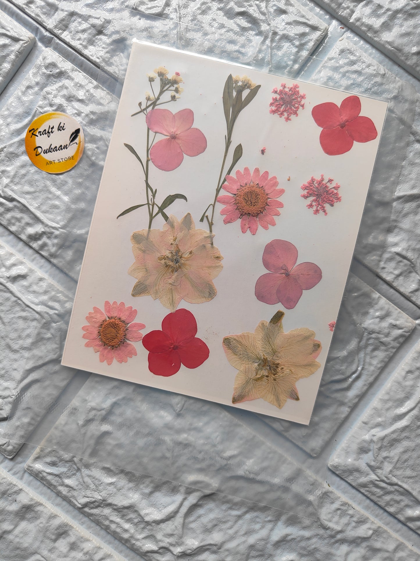 A14 resin art flower sheets featuring colorful pressed flowers on a white background