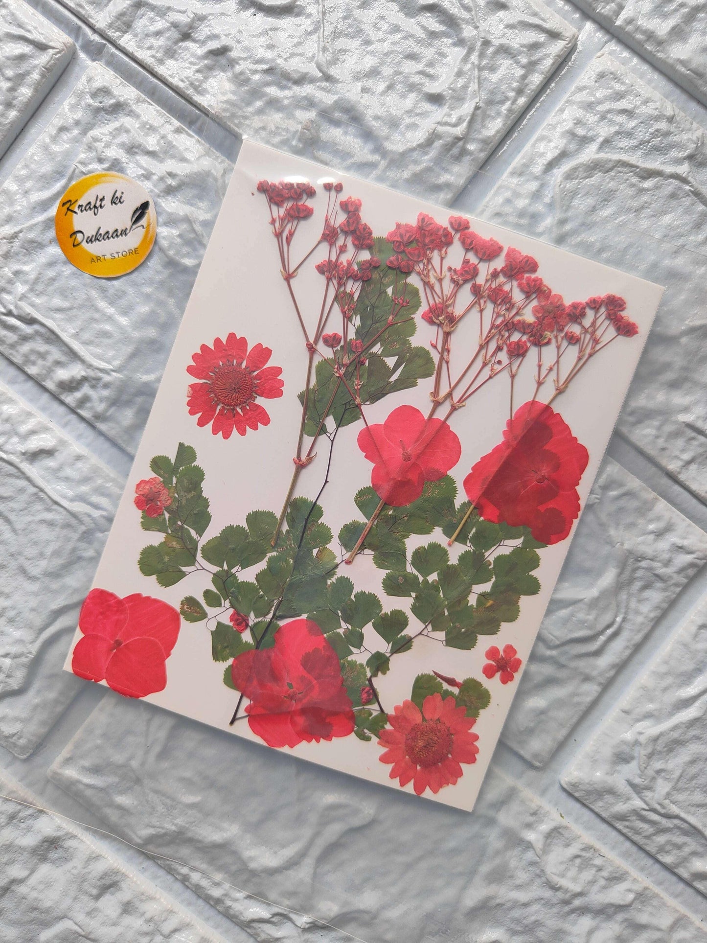 Pressed Flower Sheet Mix A15 with red and pink blooms and green leaves on a sheet