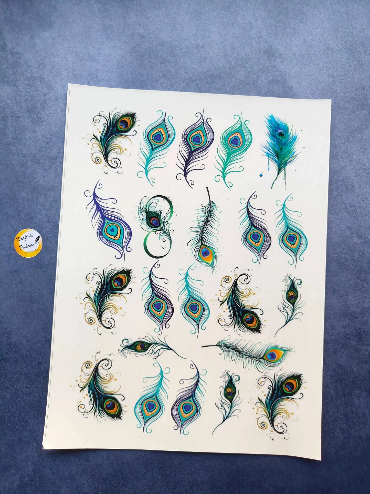 A4 colorful sticker sheet with peacock feather designs in teal, blue, and green