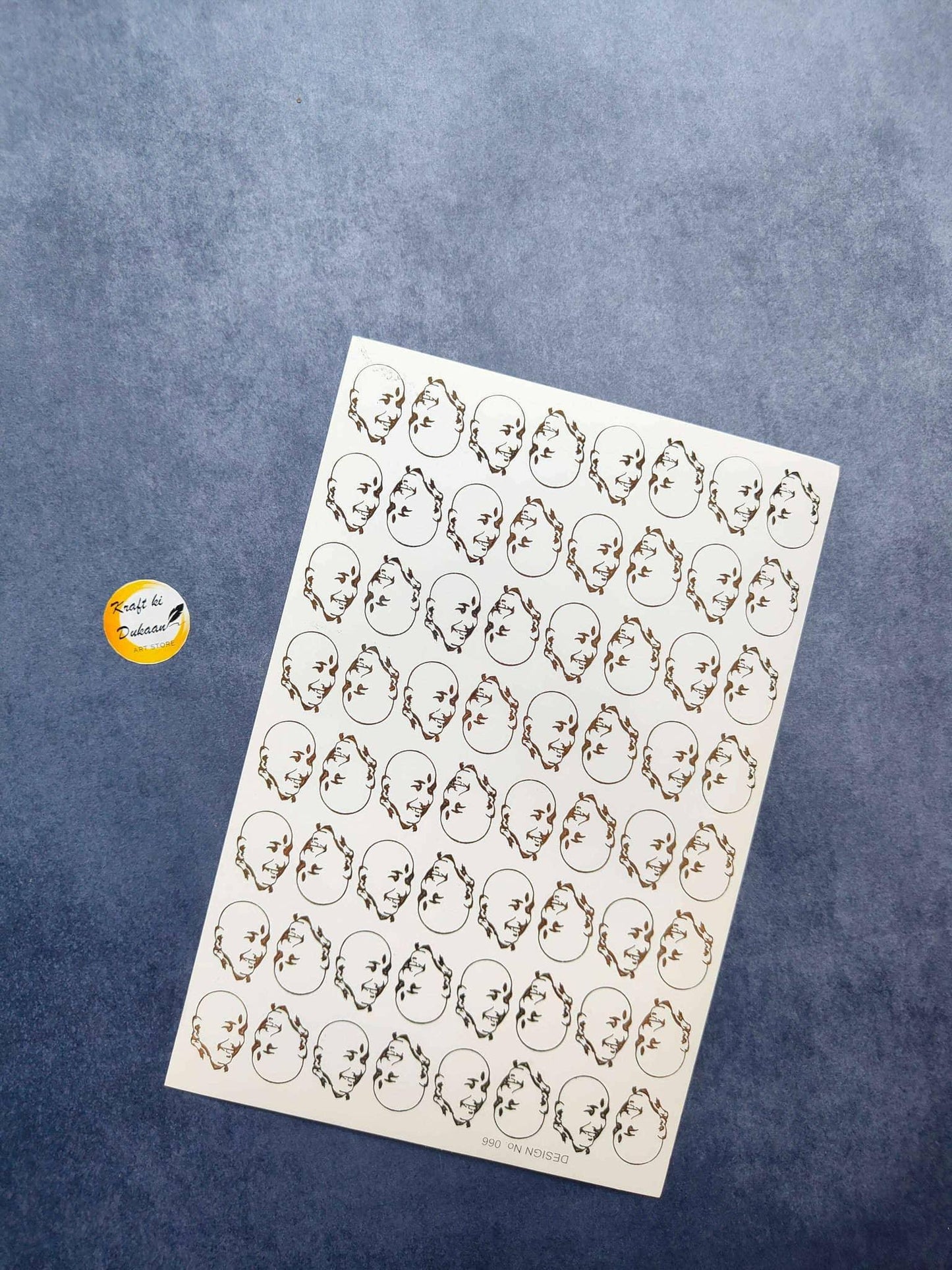 A5 gold embossed sticker sheet with small face portraits, sheet view