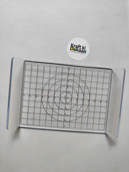Acrylic clay press plate, top view of concentric circle template on grid