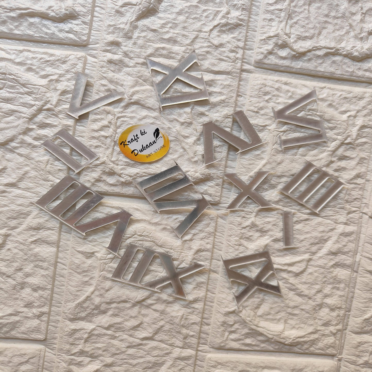Acrylic Roman numerals for crafts displayed on a textured surface, ideal for creative projects