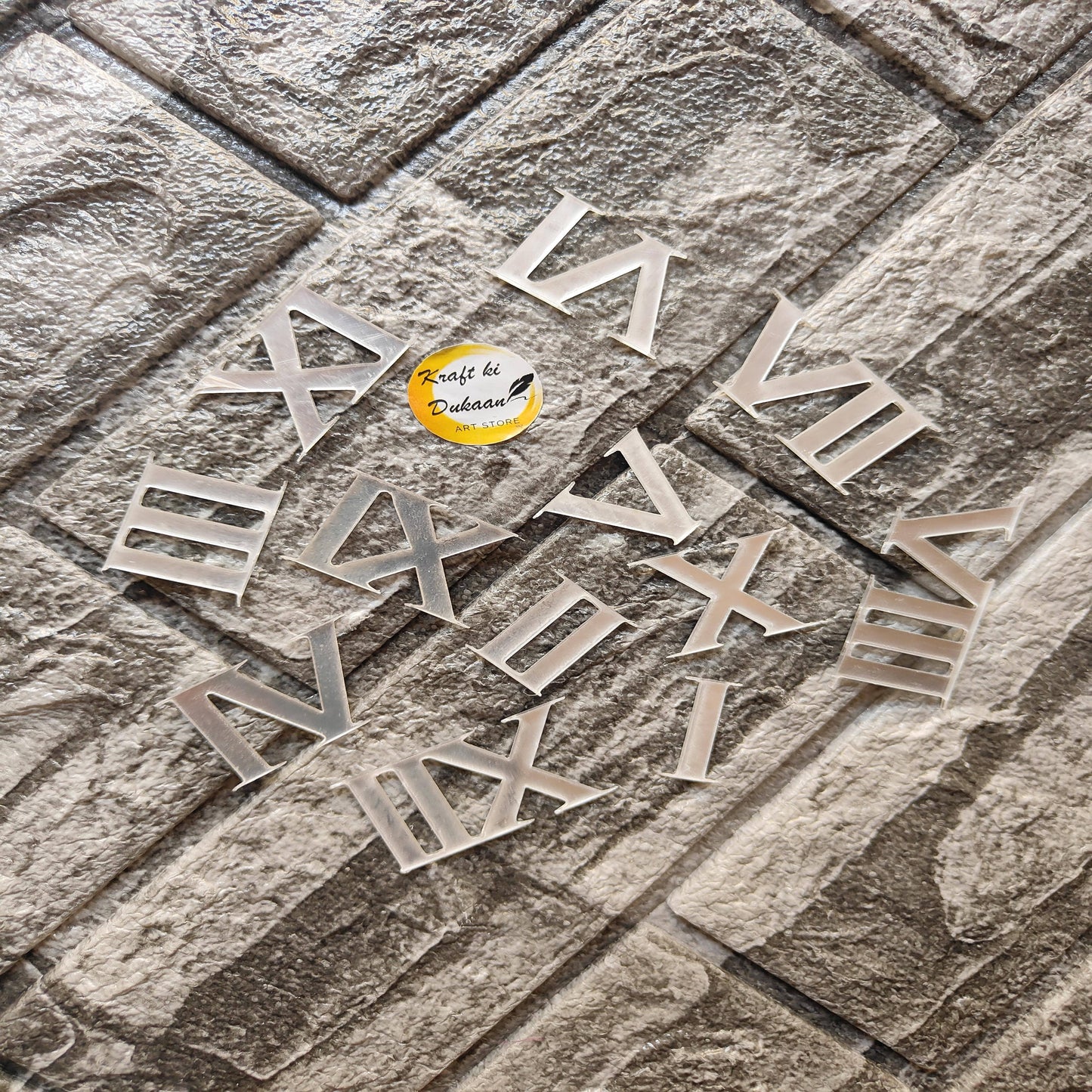 Set of acrylic Roman numerals for crafts arranged on a textured surface from Kraft ki Dukaan