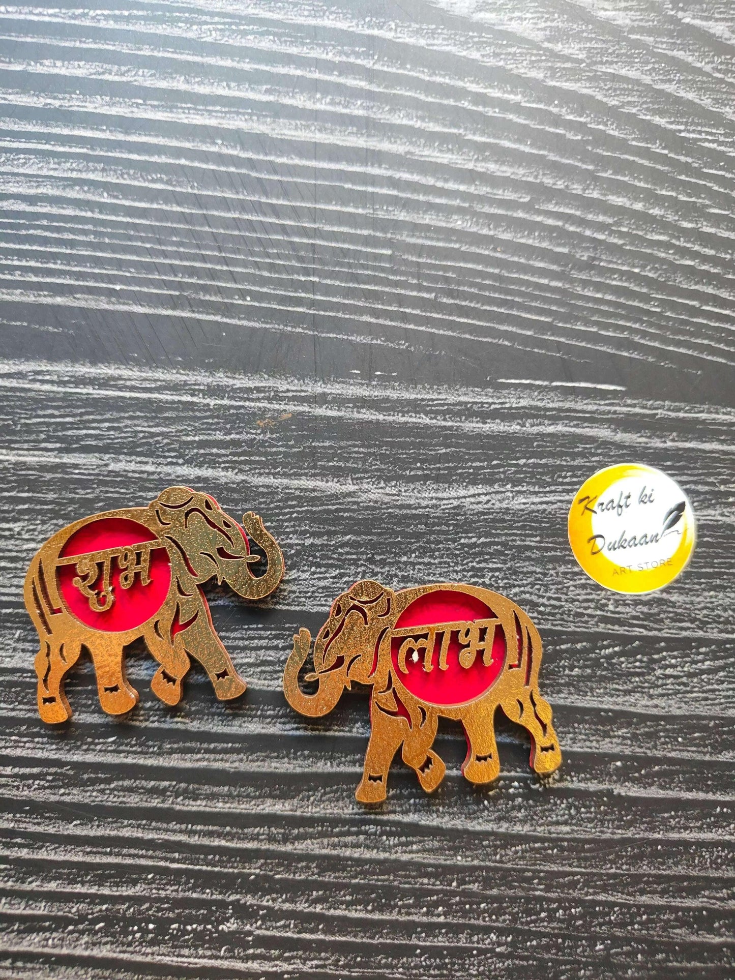 Acrylic Shubh Labh cutout with two elephants and red Devanagari text discs