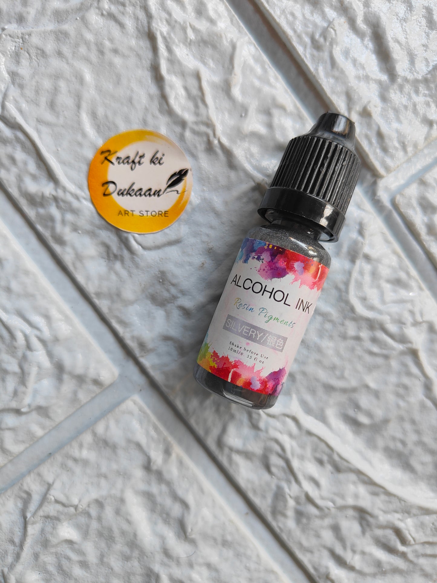 Bottle of alcohol ink for resin art in vibrant colors by Kraft ki Dukaan for creative projects