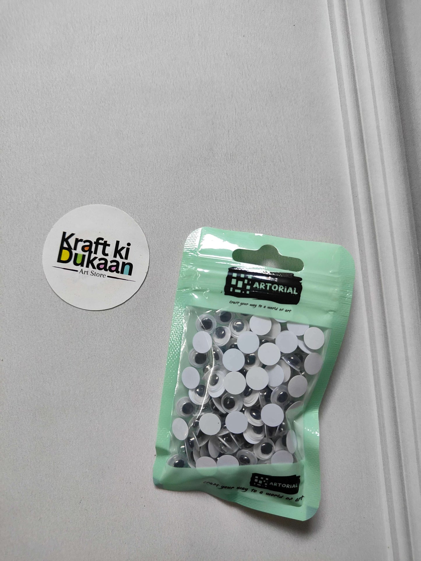 Googly eyes round 7mm, pack of 125 in green pouch; black-and-white circles