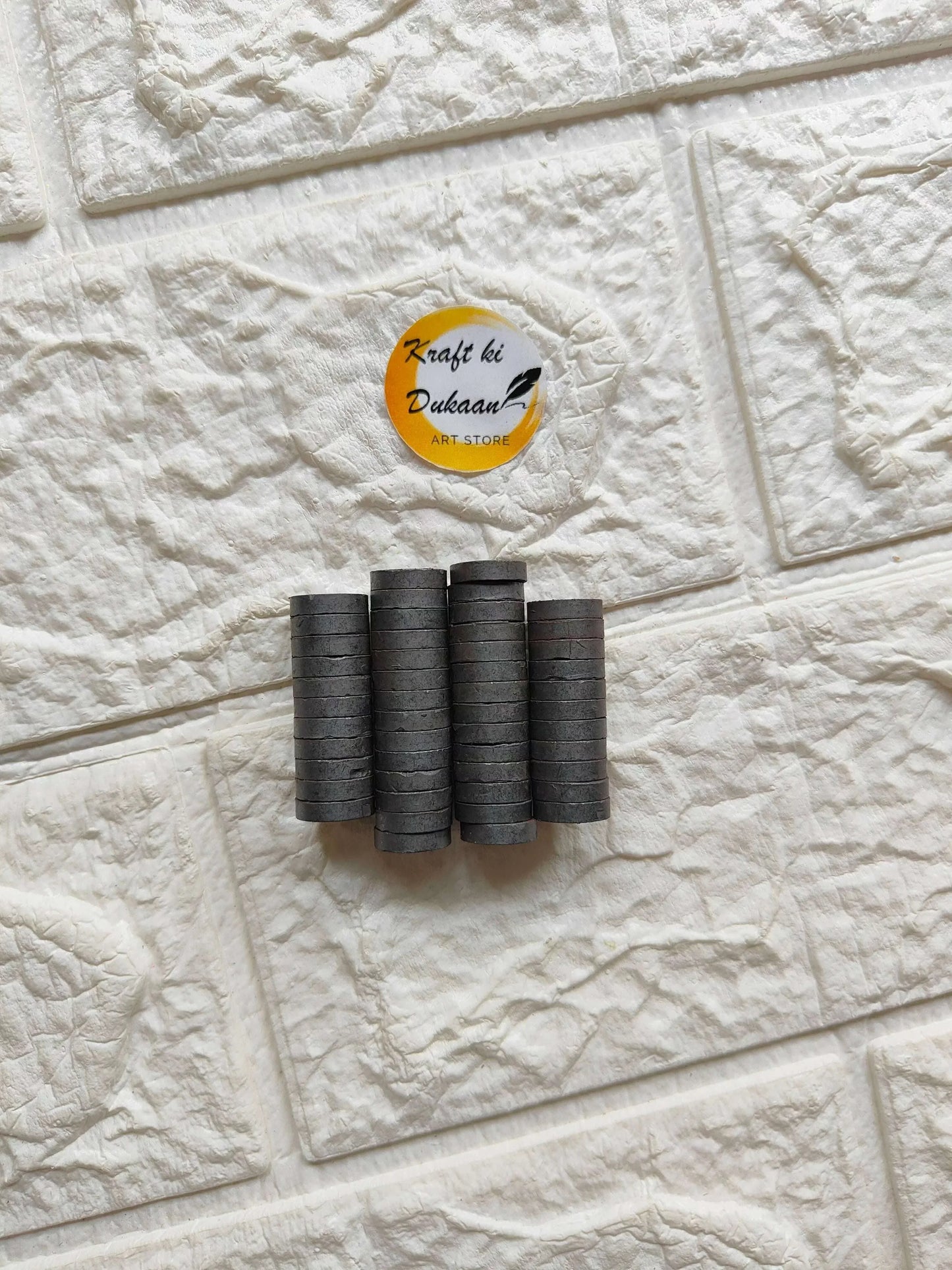 Stacked black round magnet discs, 12x3mm size