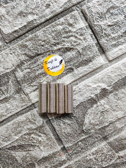 10x1.5mm round steel magnets, small cylindrical rings in a neat row