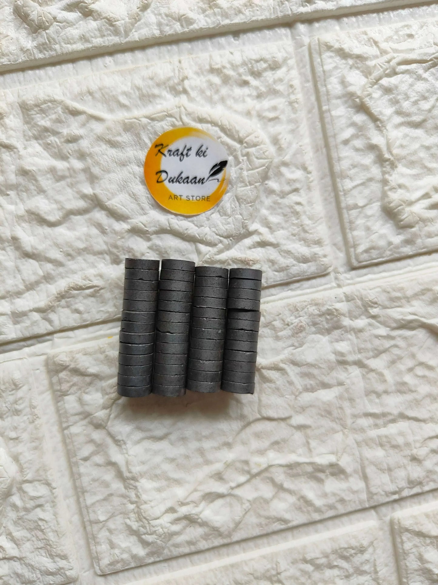 Five black cylindrical magnets with round ends, 10x3mm (50-pack)