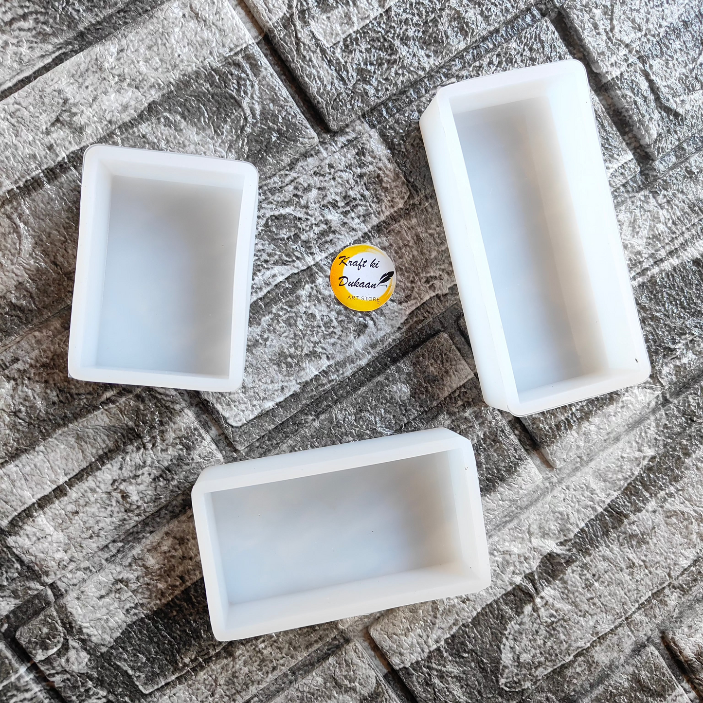 Set of three Depp Casting Moulds displayed on a textured surface, ideal block moulds for crafts