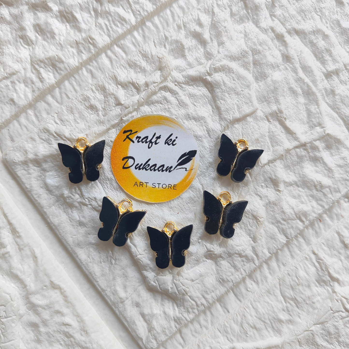 Set of butterfly resin pendant charms from Kraft ki Dukaan in elegant black design