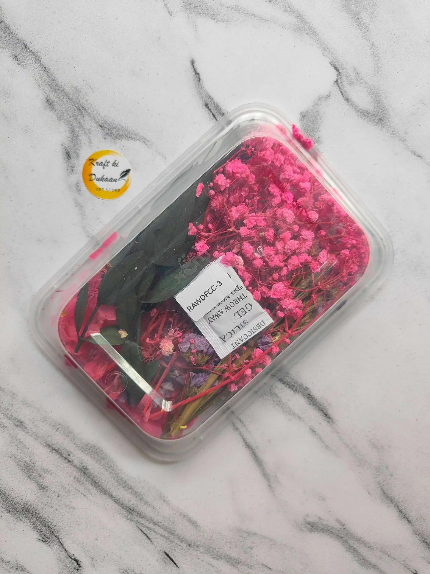Dry Flower Box E1 underside view: pink dried flowers under clear plastic lid and label