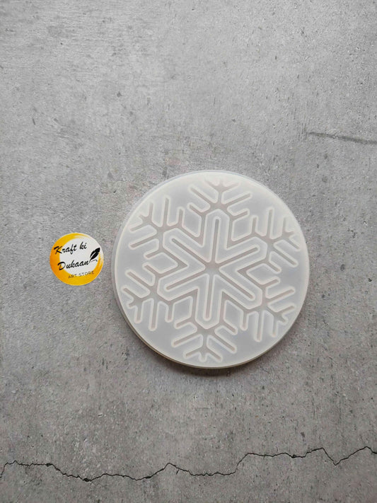 Round Christmas mould plate with raised snowflake cutout design