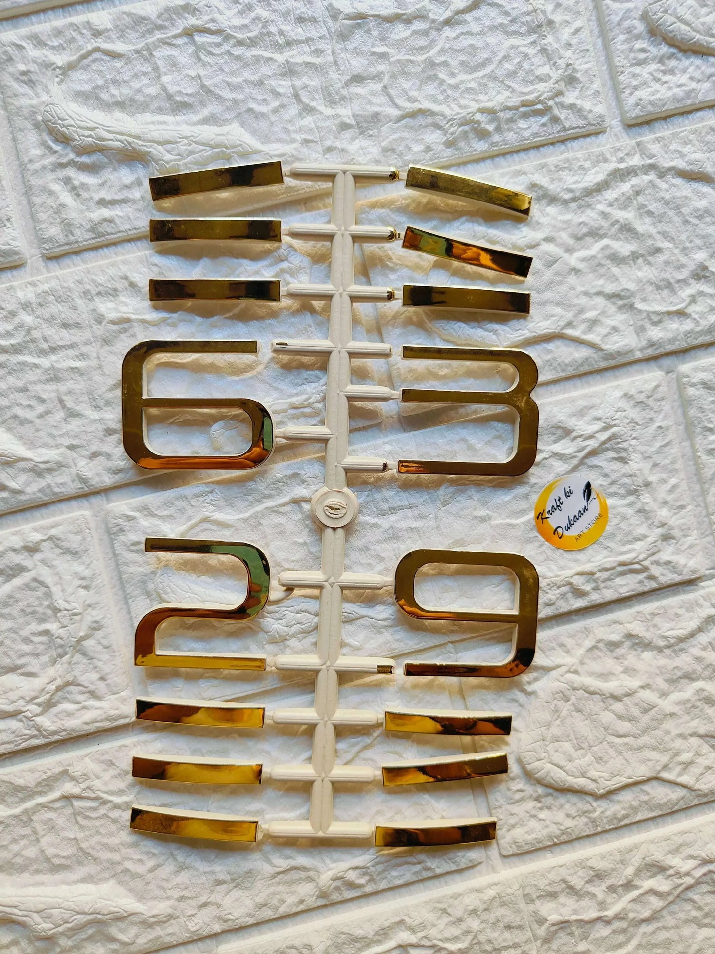 Clock number set A6: metallic gold-style numerals 0–9 on a grid display.