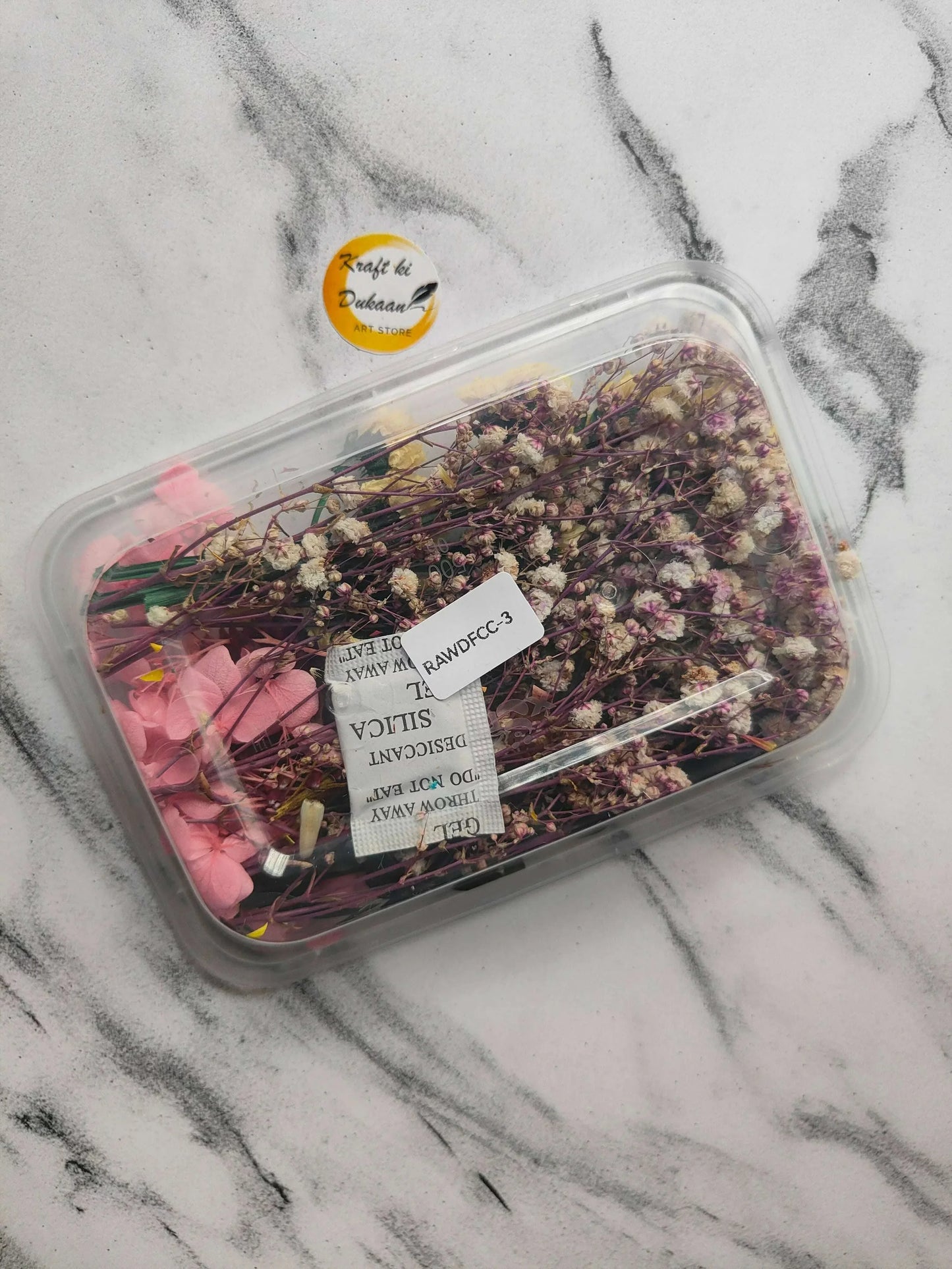 Dry Flower Box E2 with purple and pink dried flowers and stems in clear box