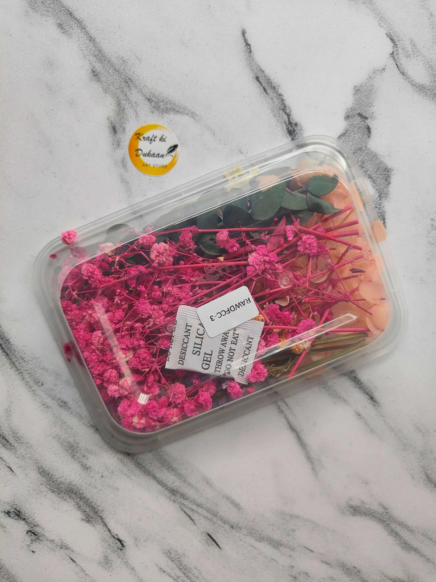 Dry Flower Box E4 with mostly pink dried flowers and dark green leaves.
