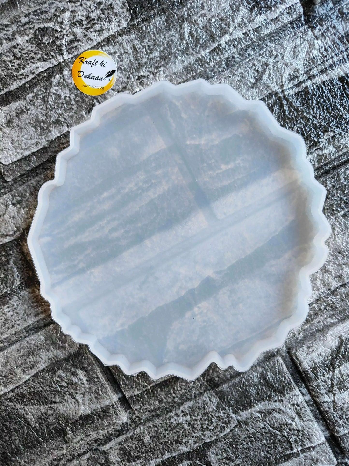 5" Agate Round Mould: round scalloped mold, light blue translucent.