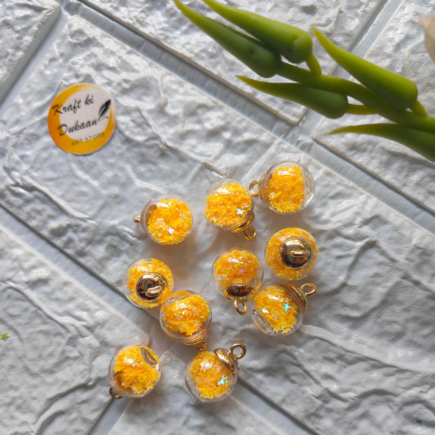 Set of ten vibrant craft glass ball pendants with golden shimmer for DIY jewelry making