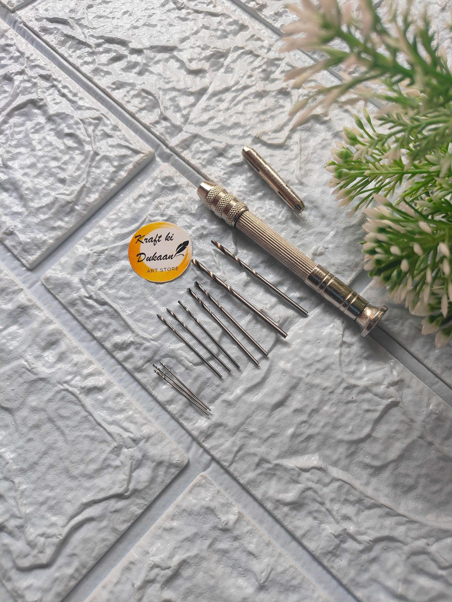 Manual hand drill with metal handle and assorted drill bit set