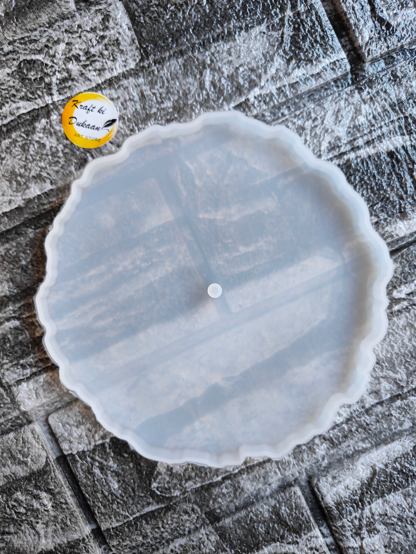 6 inch round silicone mold with scalloped edges on textured stone background by Kraft ki Dukaan
