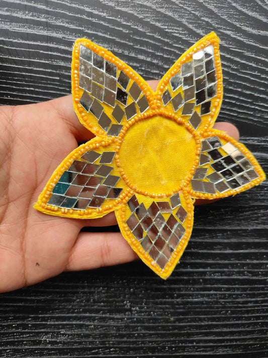 Yellow flower decorative patch with mosaic tile petals and round center
