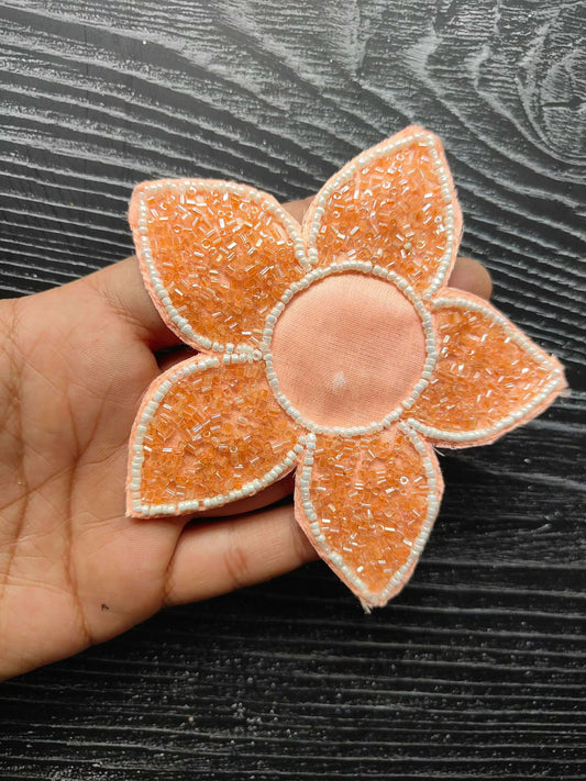 Peach flower decorative patch with round center, bead-studded layered petals