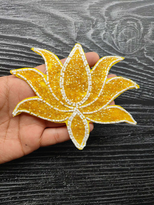 Yellow beaded leaf applique patch with white stitched outline, sew-on decoration