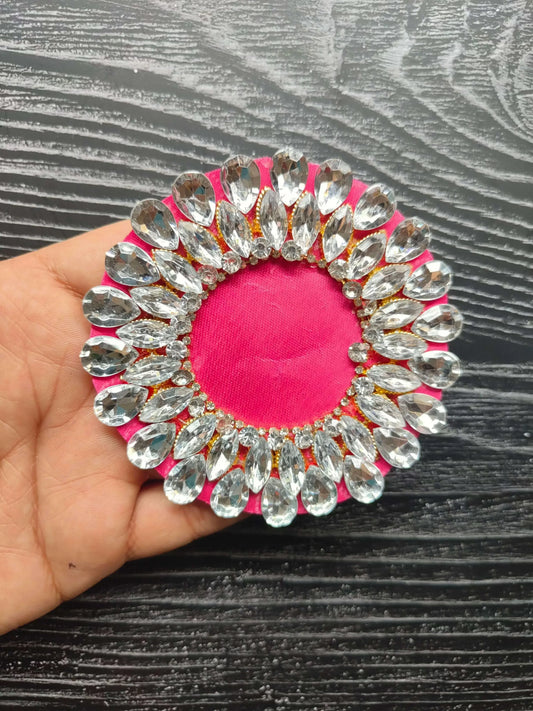 Decorative rhinestone patch with pink center fabric and silver faceted border held