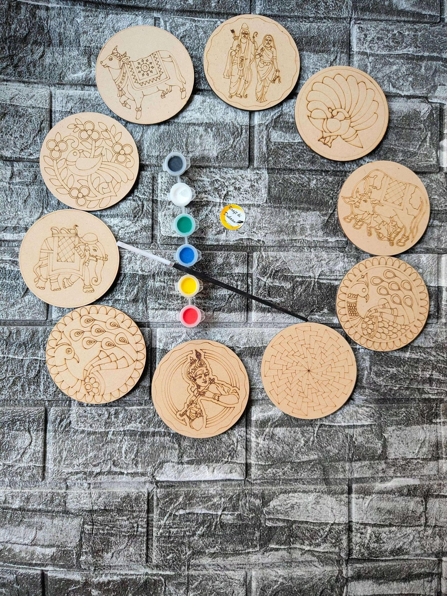 DIY mandala kit: circular MDF discs with pre-drawn designs and paint pots