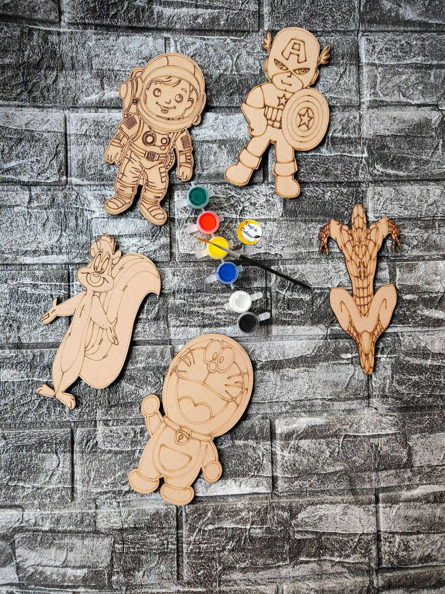 DIY MDF mandala painting kit with astronaut cutouts and paint color pots