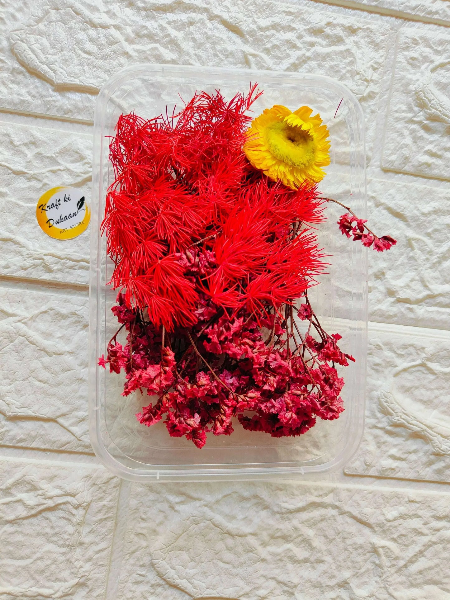 Dry Flower Box C1: clear box with red dried flowers and one yellow flower