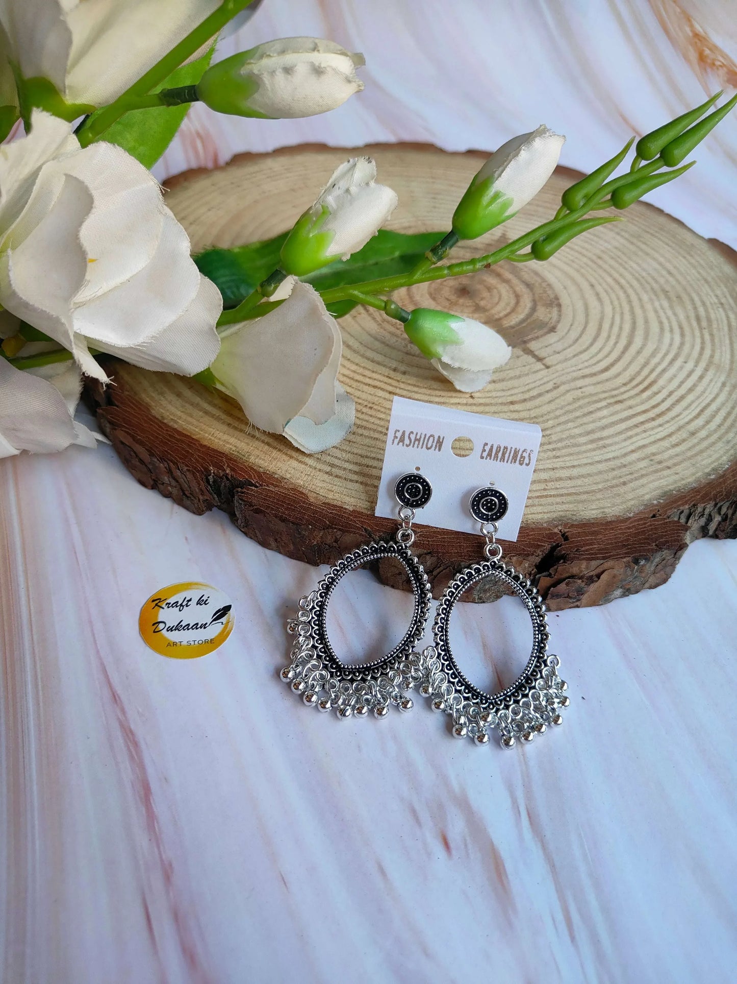 Silver jhumka earrings without beads, circular danglers with ornate fringe