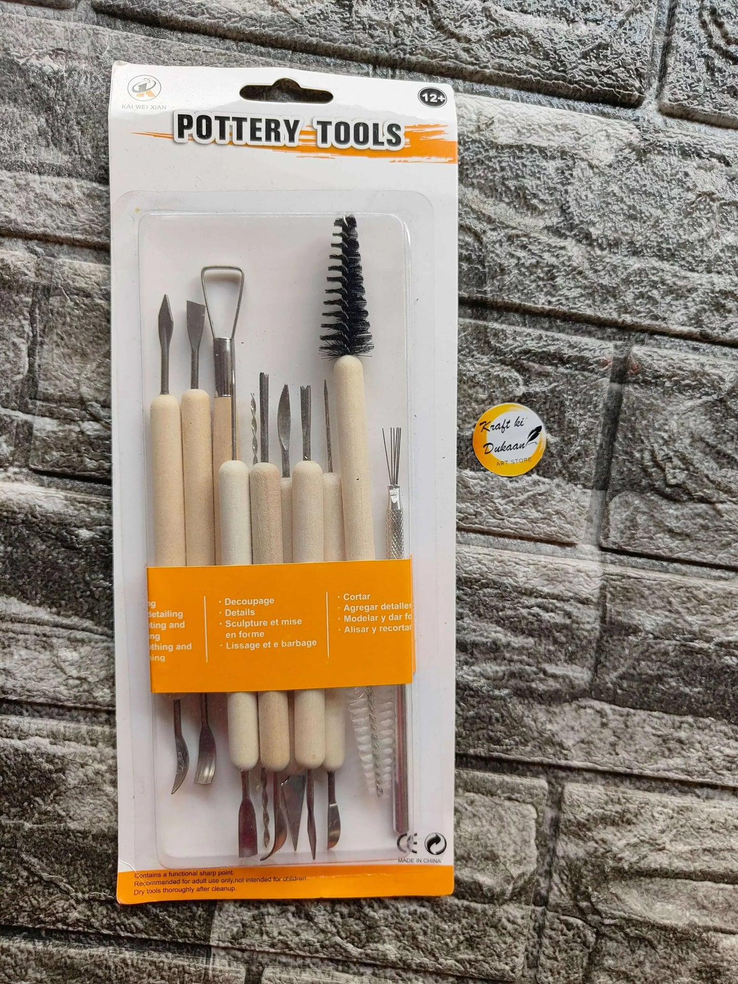 Pottery tools blister pack showing clay sculpting tools with wooden grips and metal blades