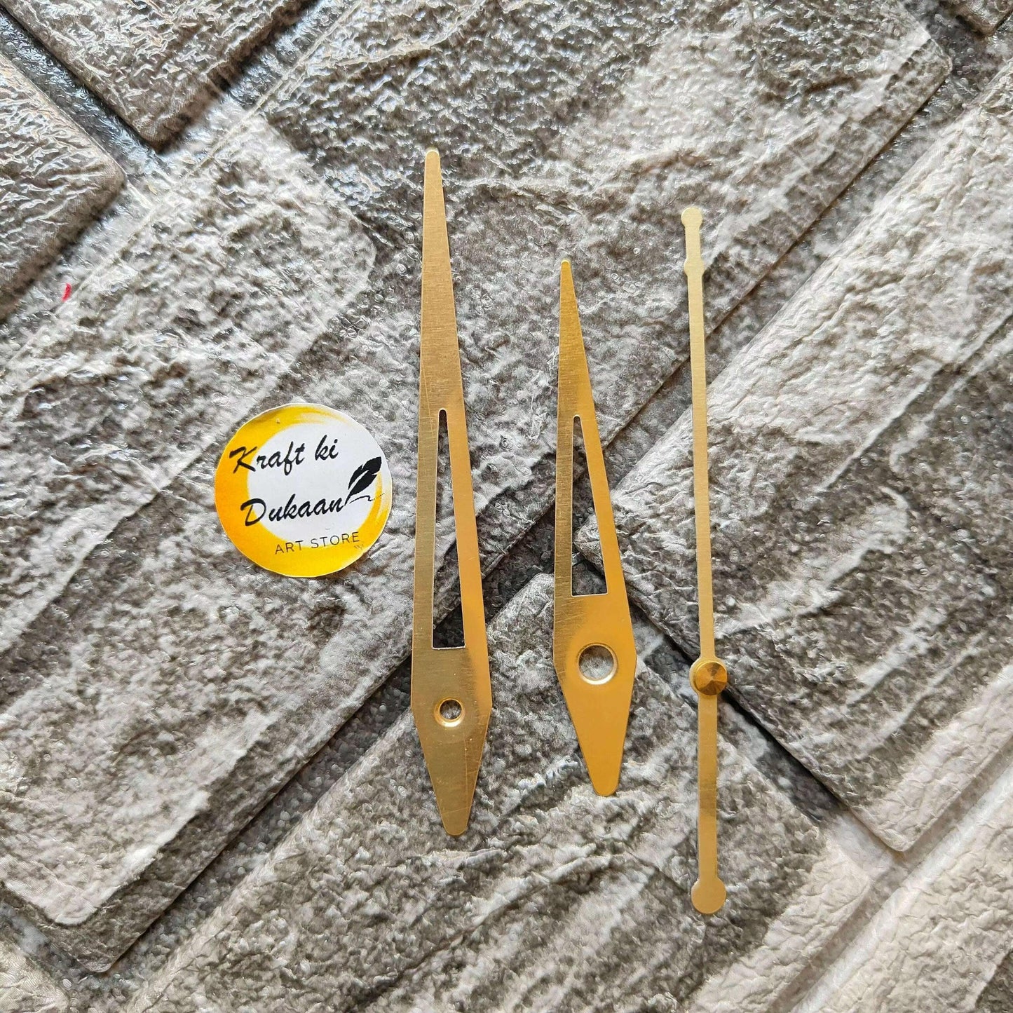 Gold metal clock hands set of three, with spindle holes and pointed ends