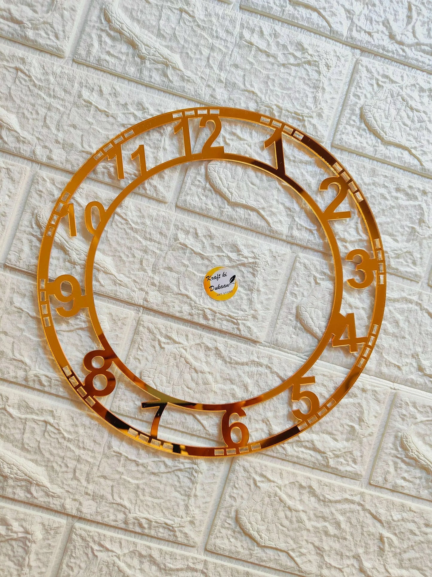 Golden acrylic clock number ring with 1–12 Roman-style numerals around the circle