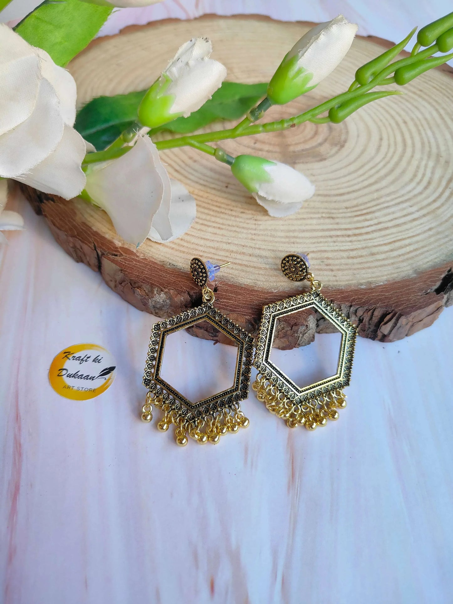 Golden jhumka drop earrings, hexagon hoops, gold-toned tassel fringe, pierced posts