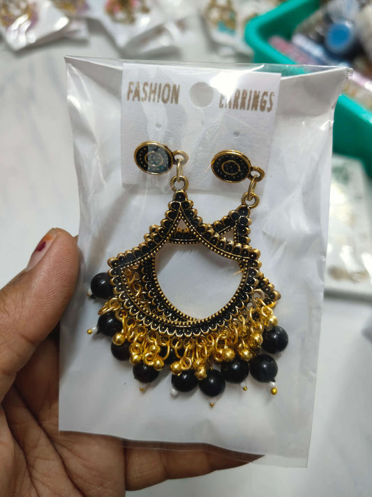 golden-jhumka-earrings-with-beads-black-bead-detail